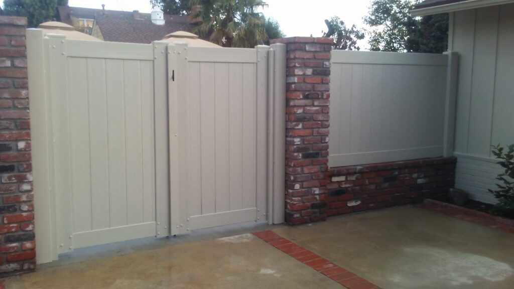 at gng vinyl, we take pride in offering a range of high-quality fencing and gate solutions that cater to the needs of modern, double privacy white vinyl swing gate with wall extension