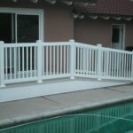 Tan-Vinyl-Deck-with-Ramp-White-Picket-Railing-500x640